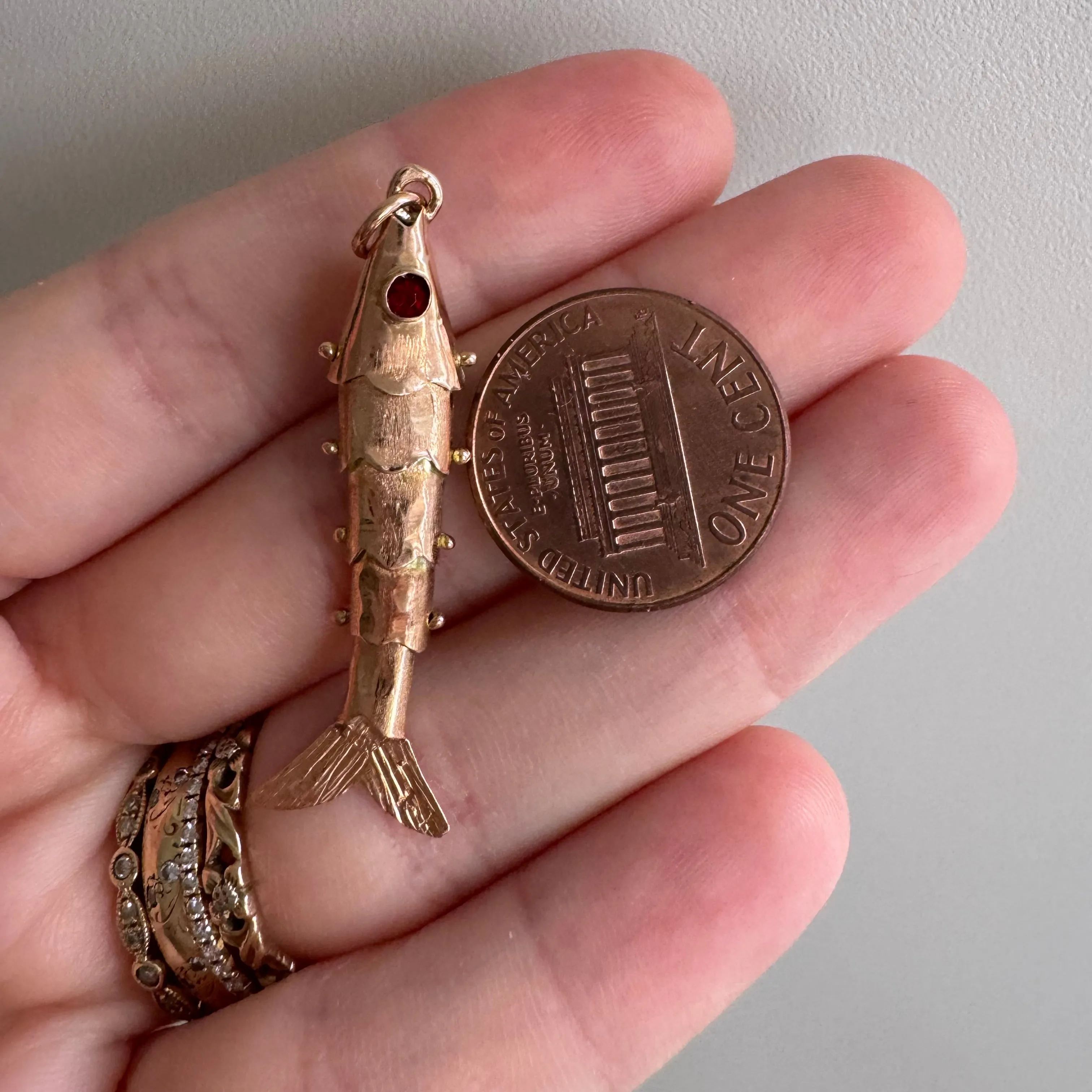 V I N T A G E // wiggly catch / 14k rosy yellow gold and red glass articulated wiggle fish / a pendant