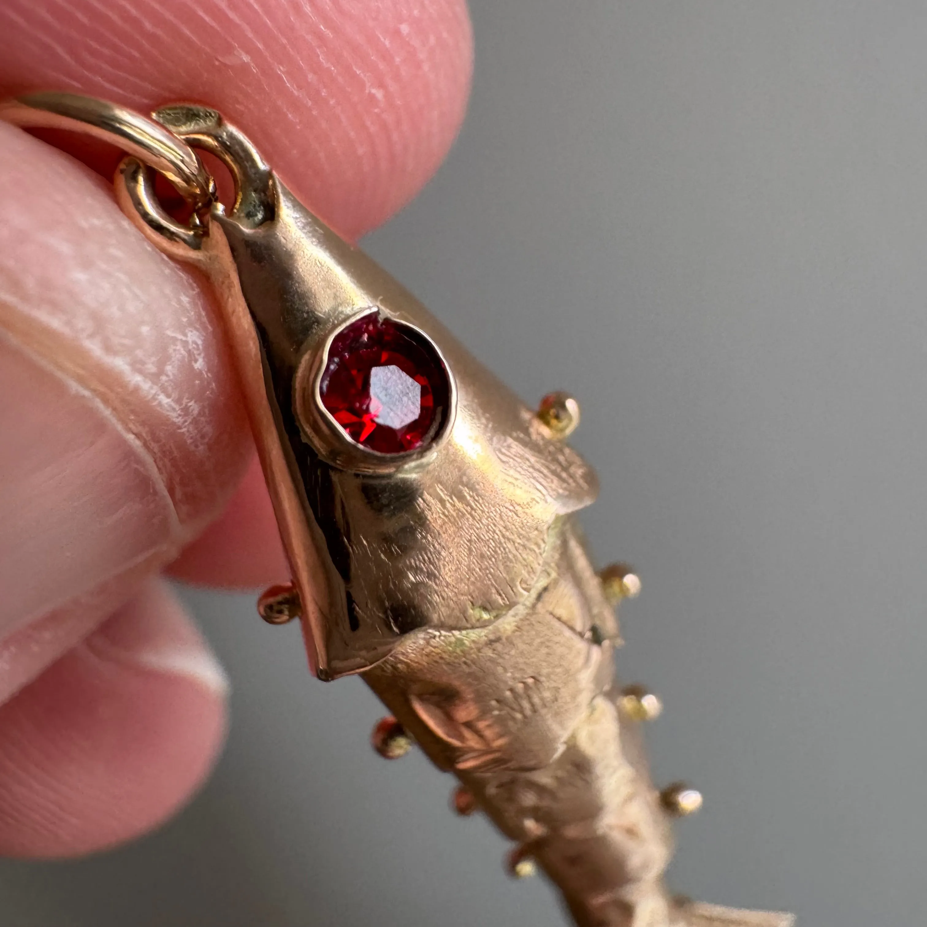 V I N T A G E // wiggly catch / 14k rosy yellow gold and red glass articulated wiggle fish / a pendant